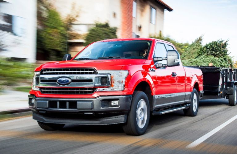 Ford F-150 Red towing a trailer