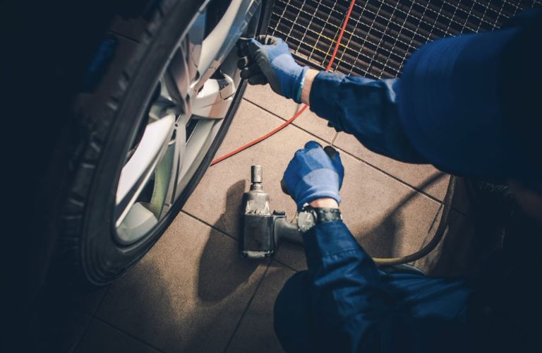 Mechanic checking tires