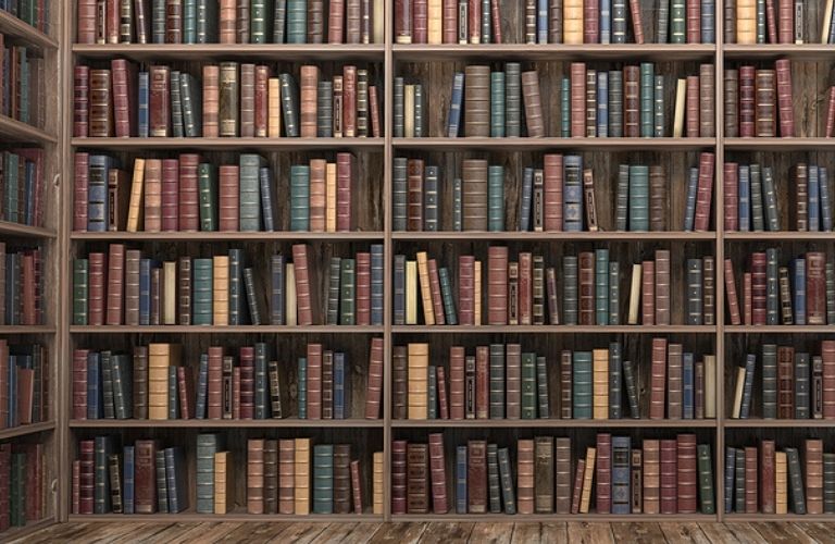 Image of books stacked on shelves