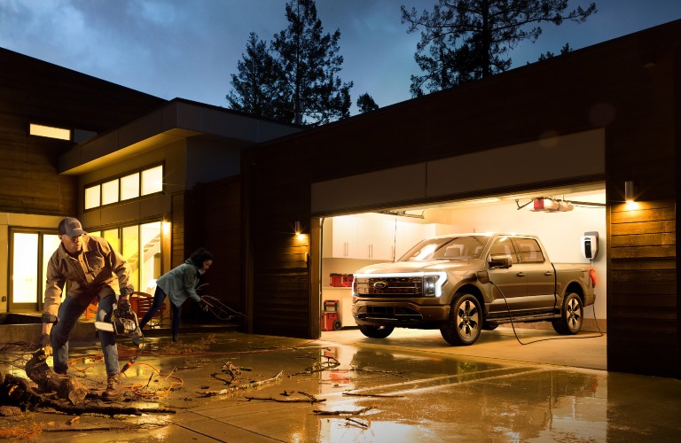 2021 Ford F-150 Lightning in garage at night