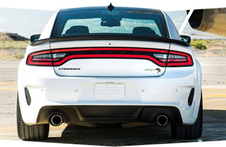 Rear side of a white 2022 dodge charger is shown
