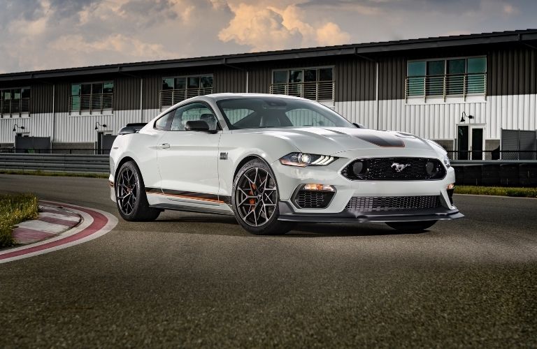 Sideview of a white 2022 Ford Mustang on a road